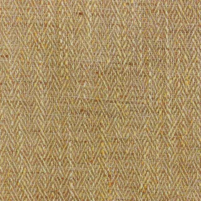 Close-up of a warm mustard-yellow woven fabric with mottled texture