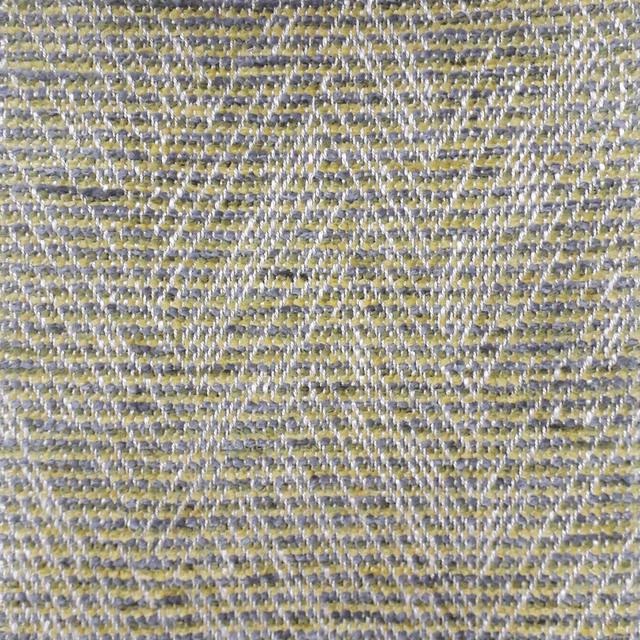 Close-up of a textured moss green woven fabric with grey threads