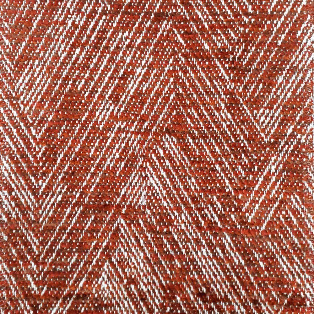Terracotta herringbone woven fabric with pale zigzag stripes