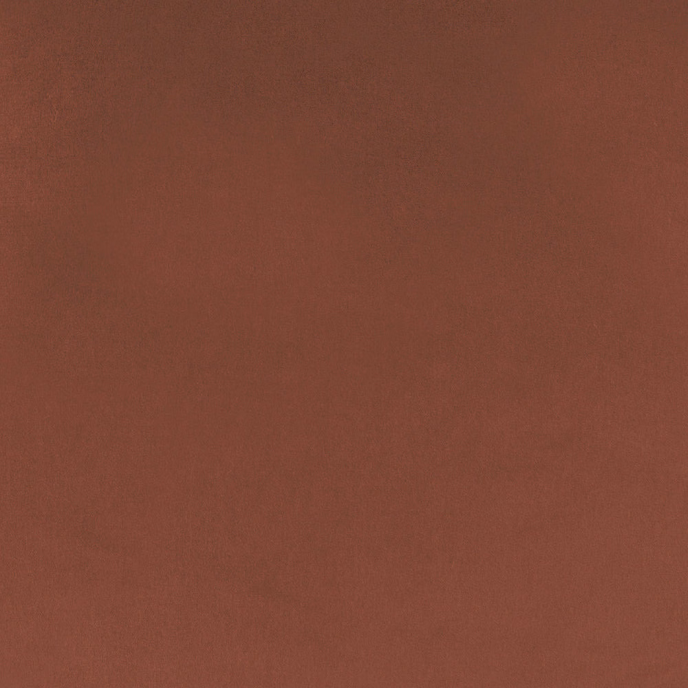 Close-up of a deep burnt orange plain woven fabric swatch