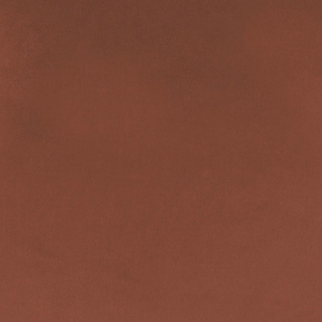 Close-up of a deep burnt orange plain woven fabric swatch