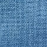 Close-up of soft denim blue woven fabric with fine textured weave