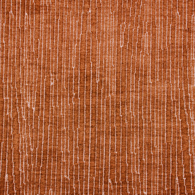 Burnt orange striated fabric with fine pale vertical lines and textured weave