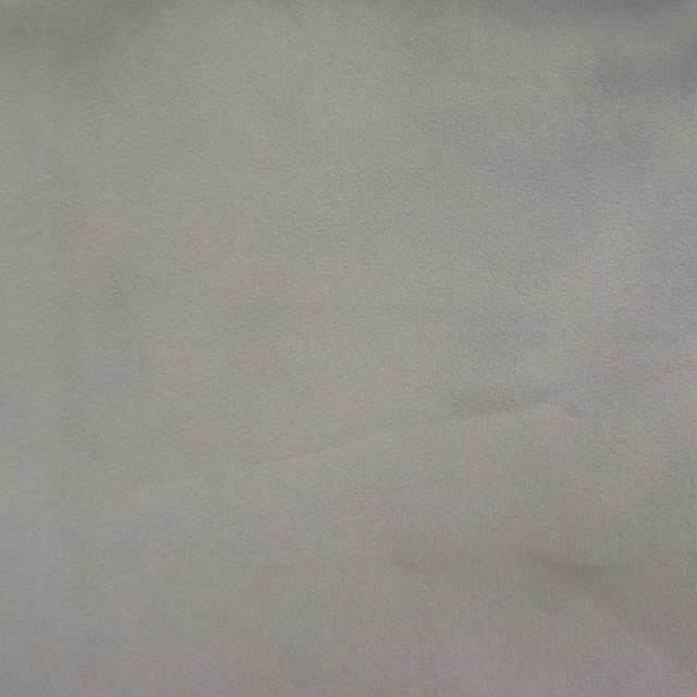 Soft dove-grey plain woven fabric swatch with a matte finish