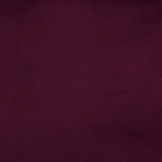 Deep plum purple plain woven fabric swatch with a smooth matte surface