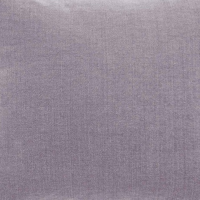 Close-up of a soft dusty lilac plain-woven fabric with a fine textured surface