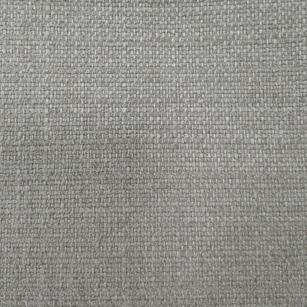 Close-up of a soft beige woven upholstery fabric with a subtle textured surface