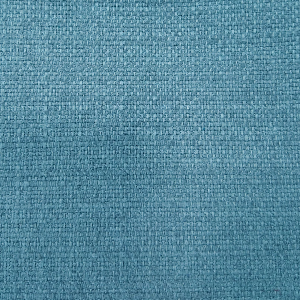 Close-up of a teal-blue textured woven fabric with fine mottled flecks