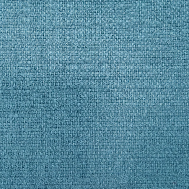 Close-up of a teal-blue textured woven fabric with fine mottled flecks