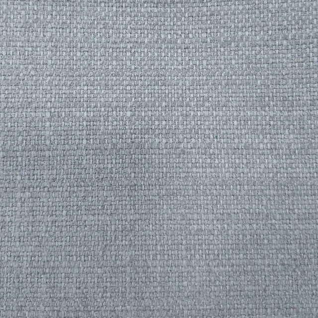 Close-up of a soft blue-grey woven fabric with a fine textured basket weave.