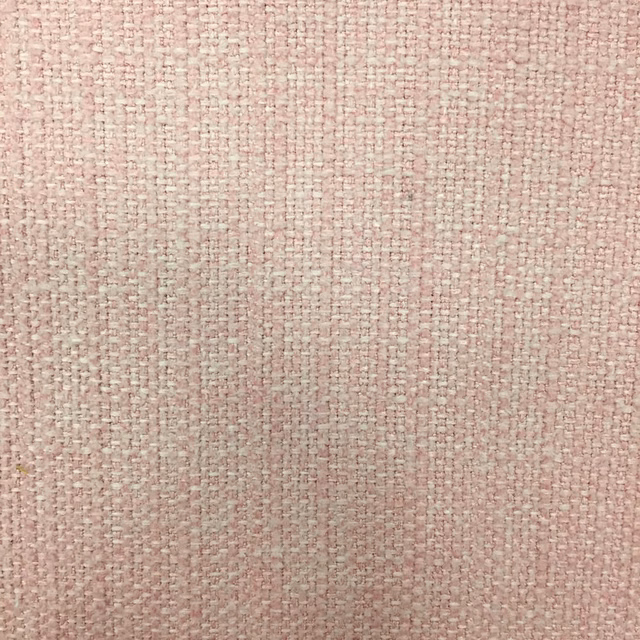 Close-up of soft blush pink woven fabric with a fine textured basketweave