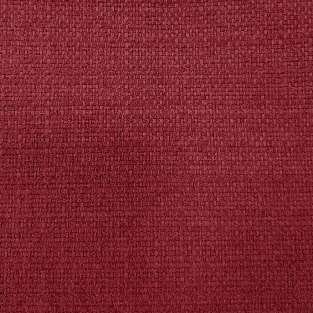 Close-up of deep raspberry red woven fabric with a textured basketweave surface