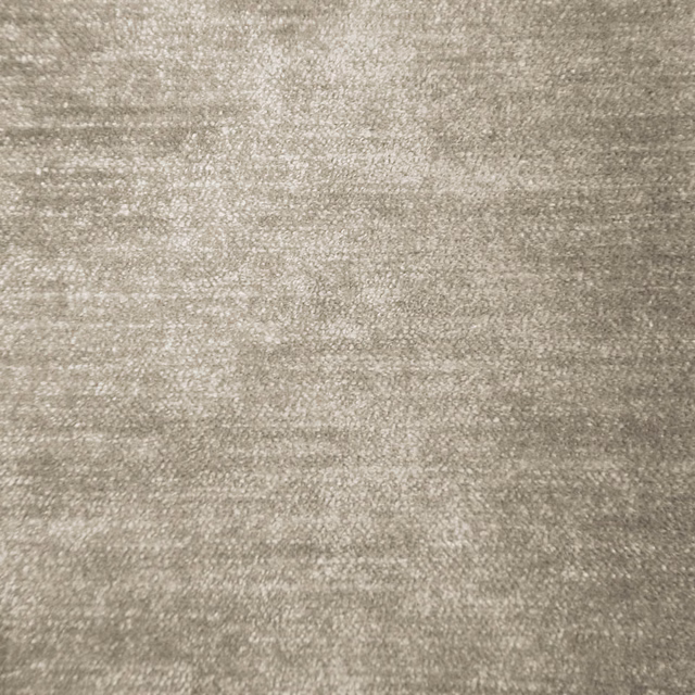 Soft warm beige woven fabric with a subtle lustre and gently mottled texture