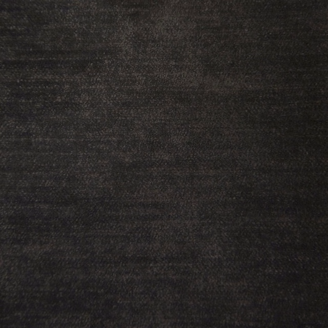Close-up of a softly textured charcoal-black woven fabric swatch