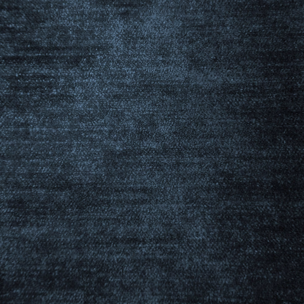 Close-up of a dark smoky blue woven fabric with a soft mottled texture