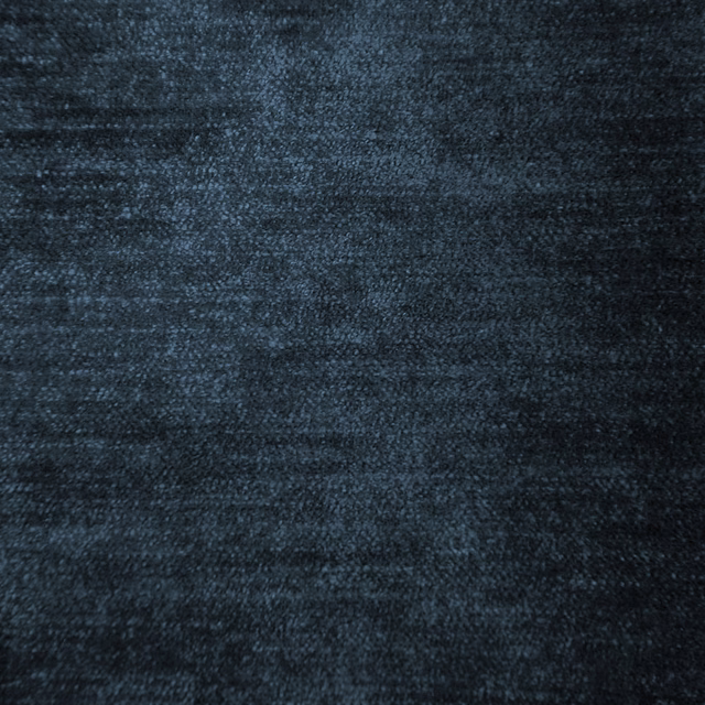 Close-up of a dark smoky blue woven fabric with a soft mottled texture