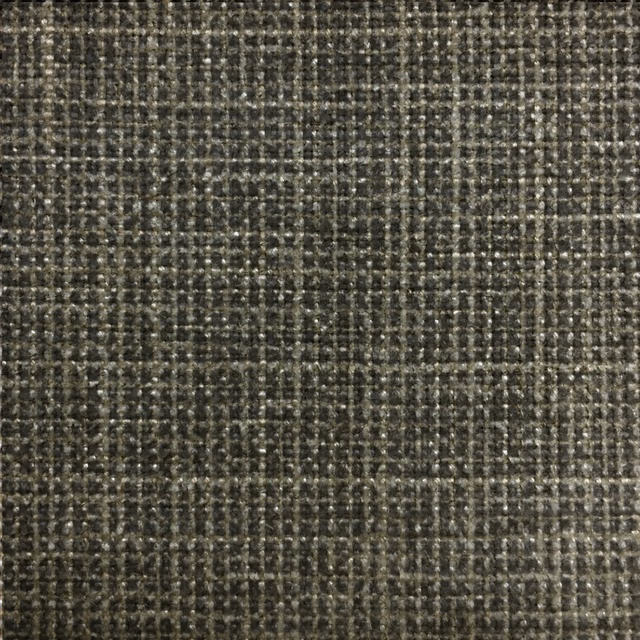 Close-up of charcoal-black textured woven fabric with pale slub highlights