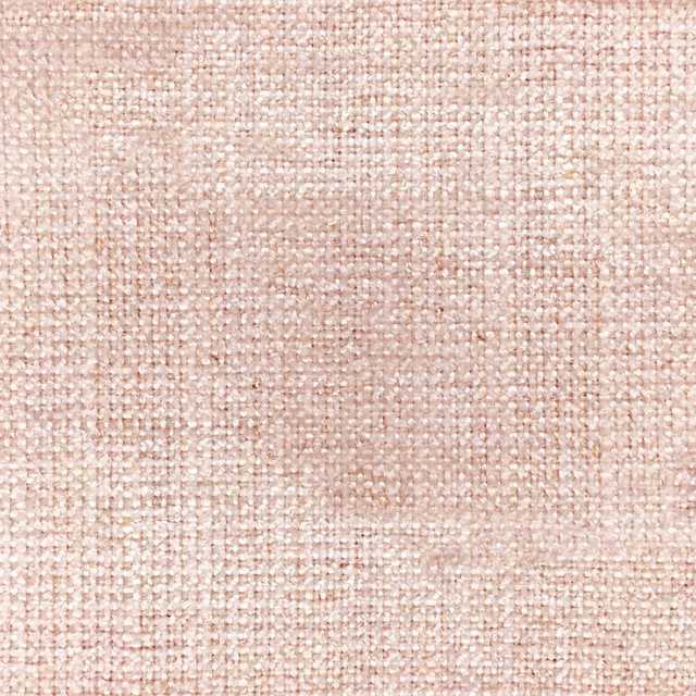 Soft blush pink woven fabric with a fine textured slub surface