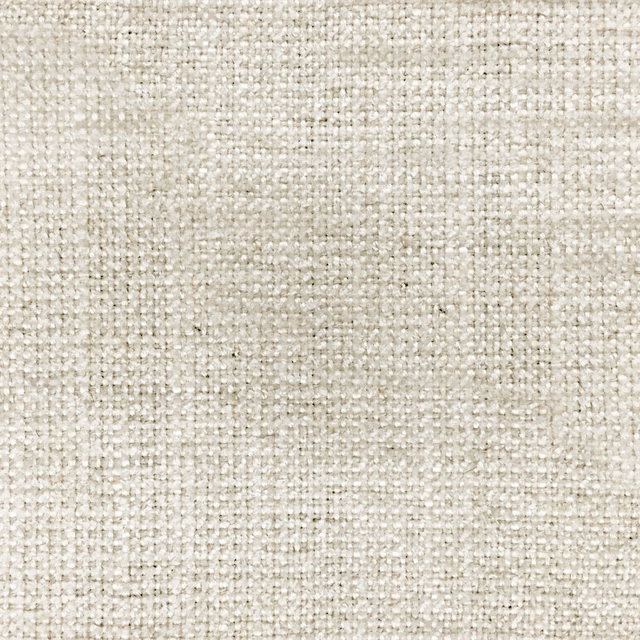 Close-up of a softly textured ivory woven fabric with fine natural slub