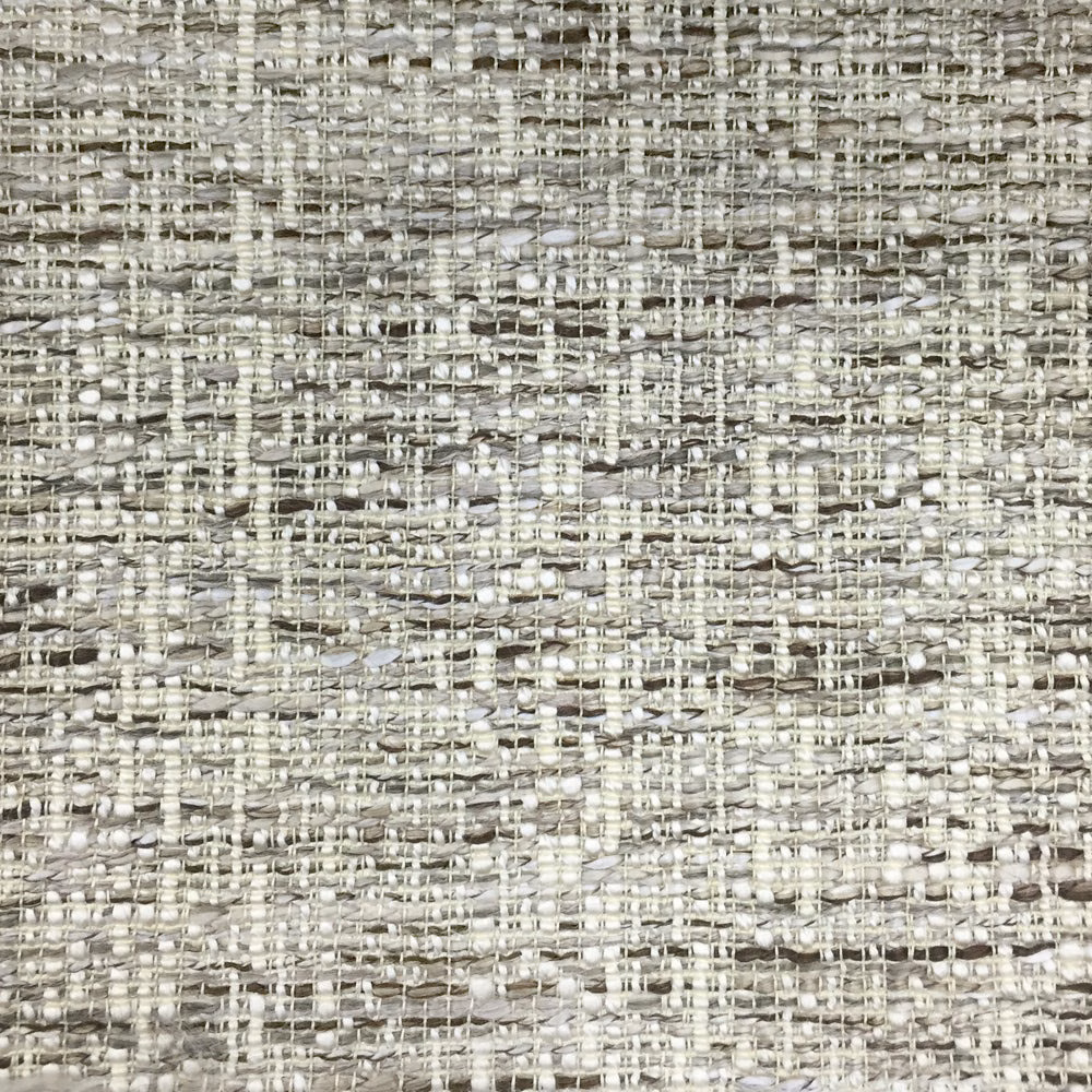 Close-up of a warm brown and stone textured woven fabric with slub yarns