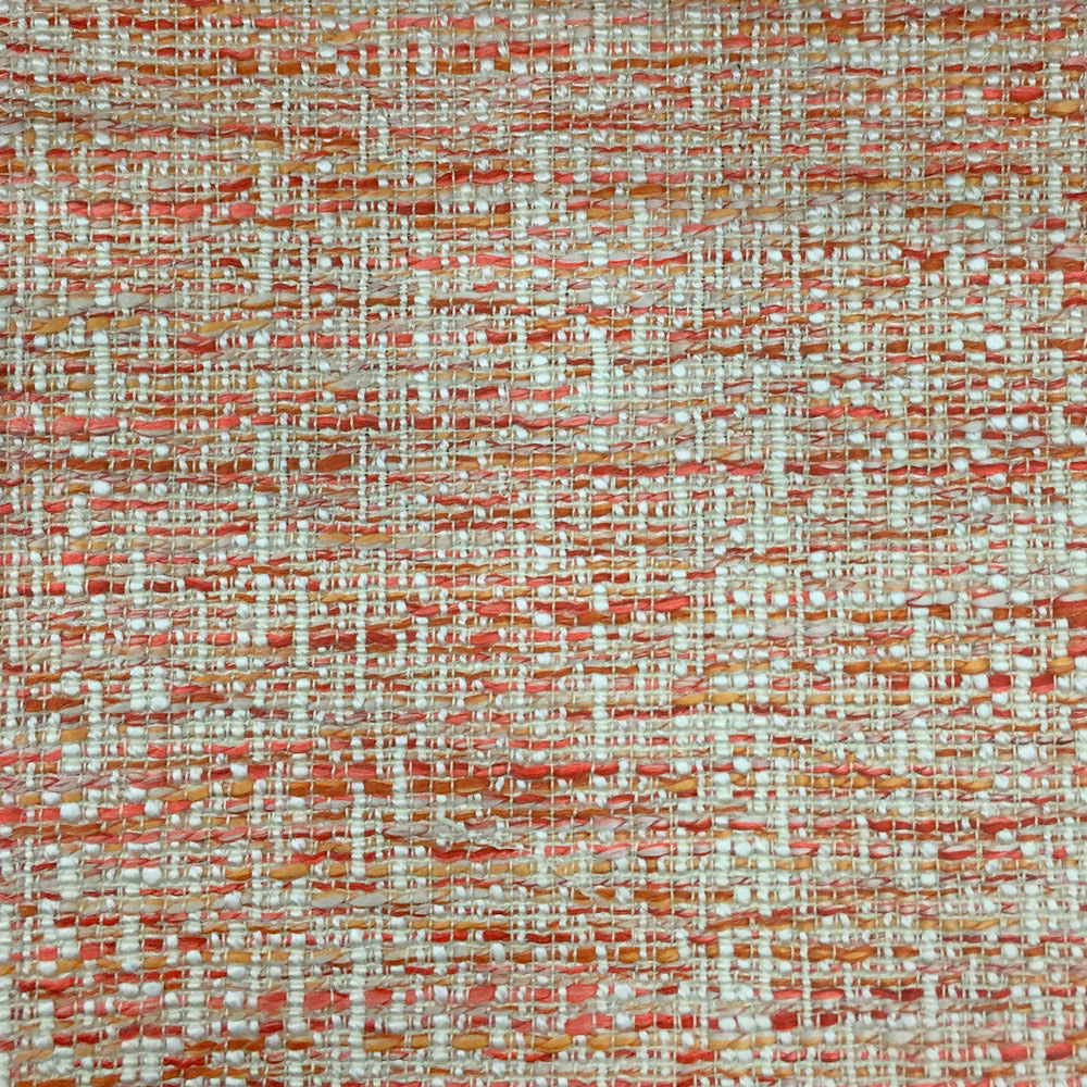 Close-up of a textured coral-orange woven fabric with cream and terracotta threads