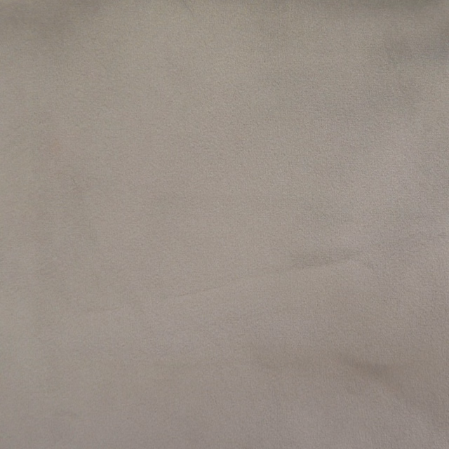 Plain soft beige fabric swatch with a smooth matte finish