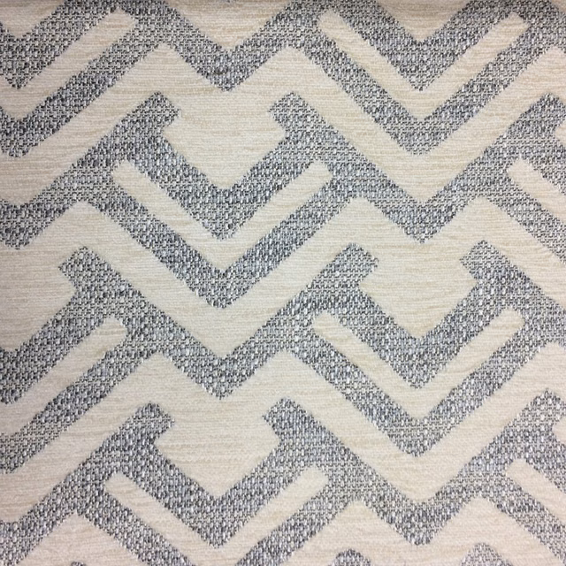 Soft grey zigzag woven fabric on a pale ground with textured surface