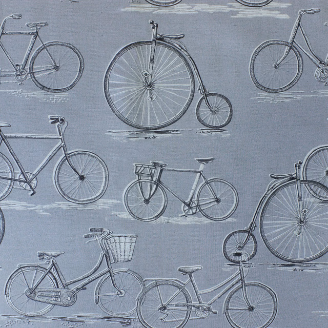 Grey fabric with repeating vintage bicycles and sketchy white ground marks
