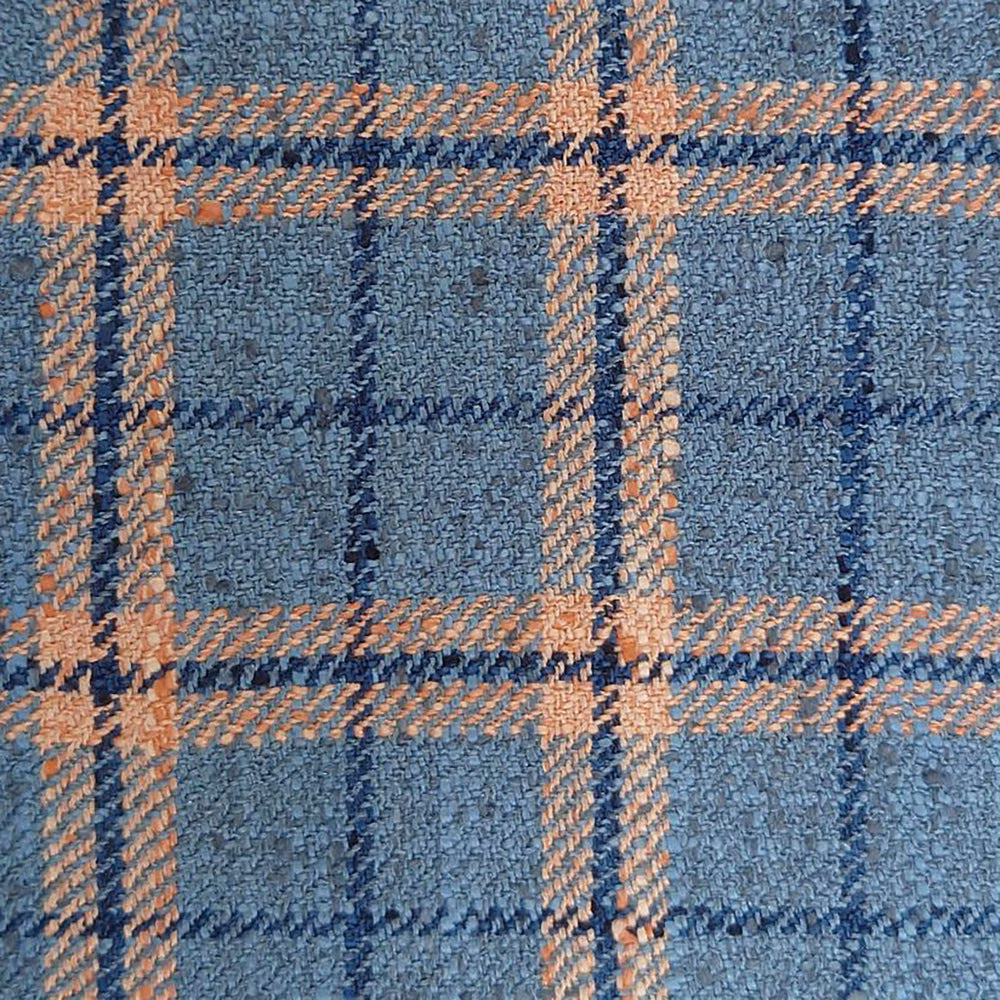 Close-up of a blue and peach checked woven fabric with textured surface