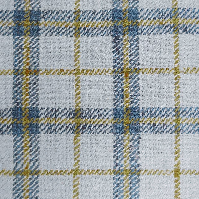 Close-up of a blue, white and mustard checked woven fabric swatch