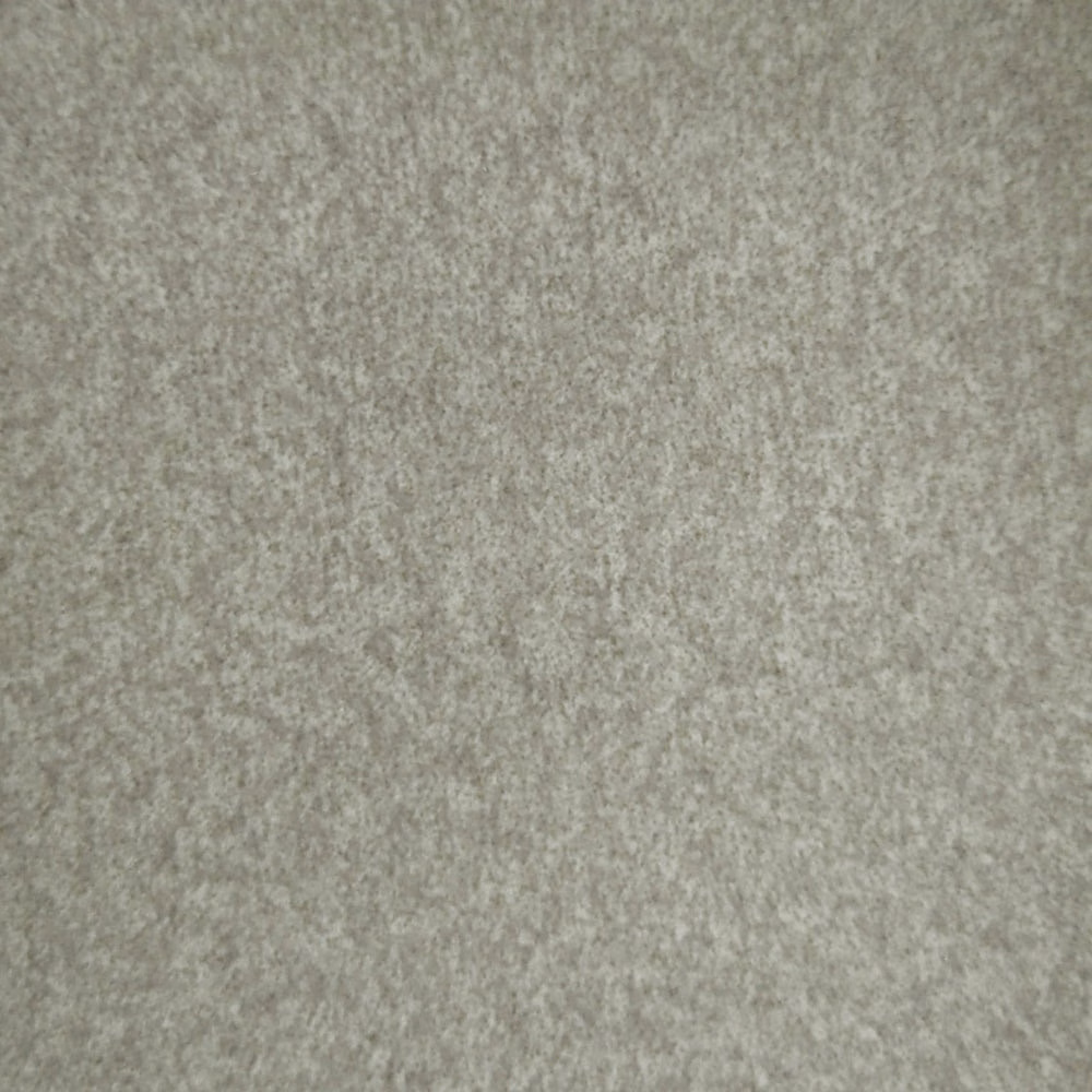 Close-up of warm beige textured woven fabric with soft mottled finish