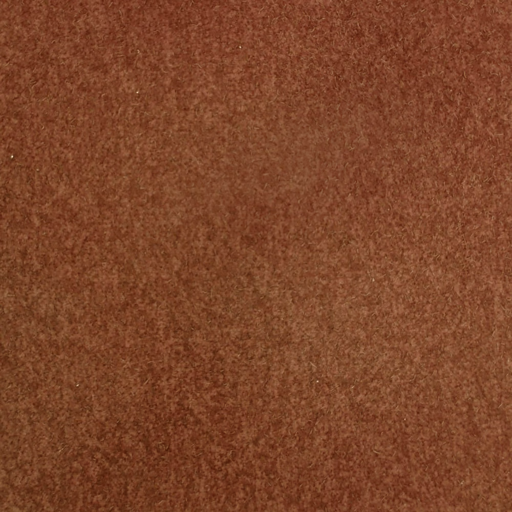 Warm burnt orange textured fabric swatch with a soft mottled weave