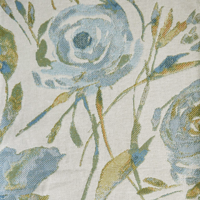 Misty blue floral woven fabric with sage stems on a pale ground