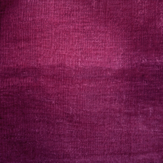 Deep magenta pink plain woven fabric swatch with subtle horizontal texture