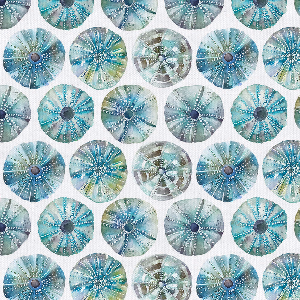 White cotton fabric with repeated sea urchin circle motifs in aqua and blue tones