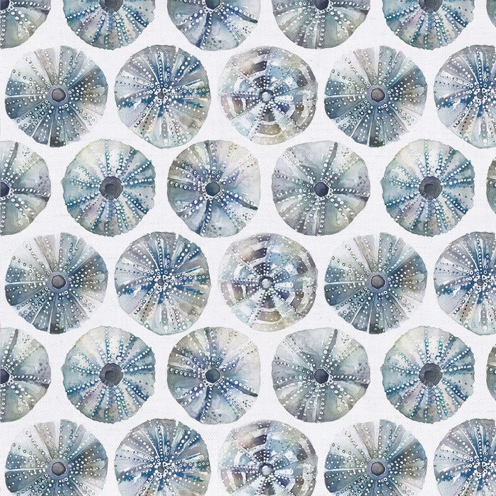 Printed circular seaurchin motifs in cool grey, seafoam and blue on a pale cotton ground