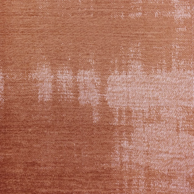 Close-up of Stratos Orange woven fabric with a terracotta sheen and abstract texture