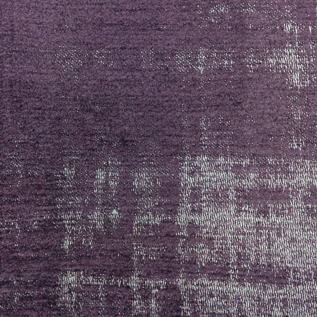 Deep plum woven fabric with distressed silver-lilac blocks and speckled texture