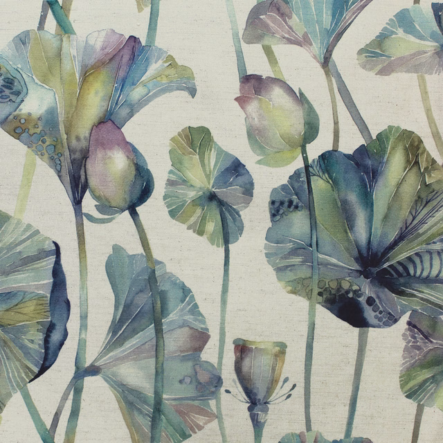 Painterly blue-green botanical fabric with large leaf motifs on a pale ground