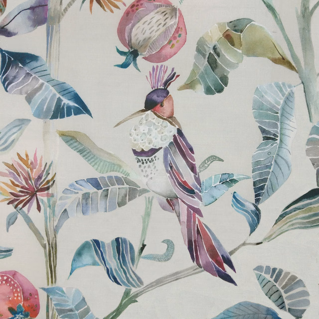 Pastel bird-and-botanical print on ivory fabric with watery blues, greens and pinks