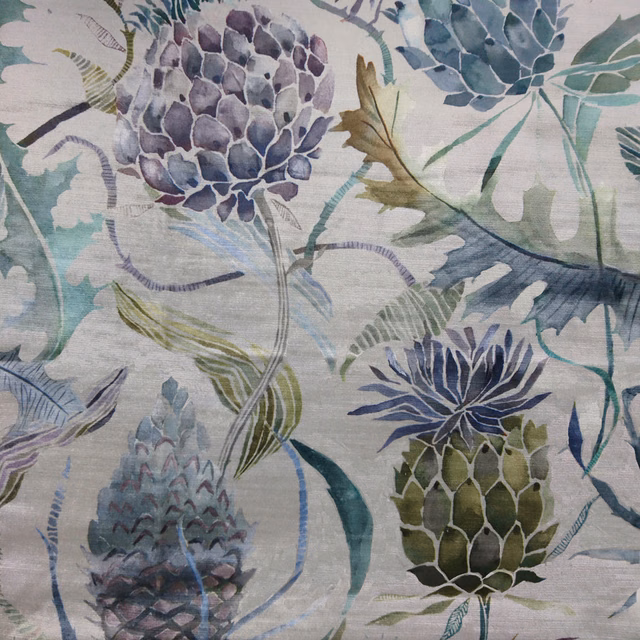 Painterly botanical fabric with purple blooms, teal leaves and leafy green motifs