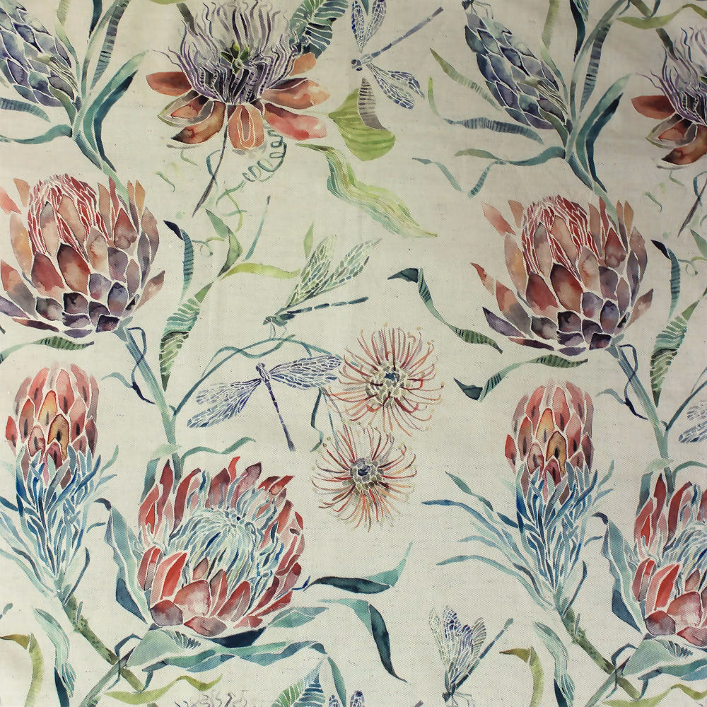 Pale botanical fabric with coral orange blooms, green leaves and blue accents