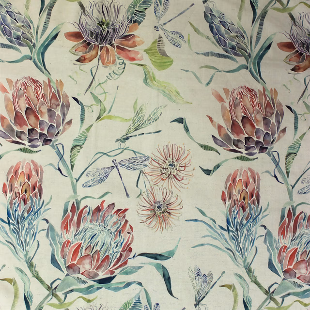 Pale botanical fabric with coral orange blooms, green leaves and blue accents