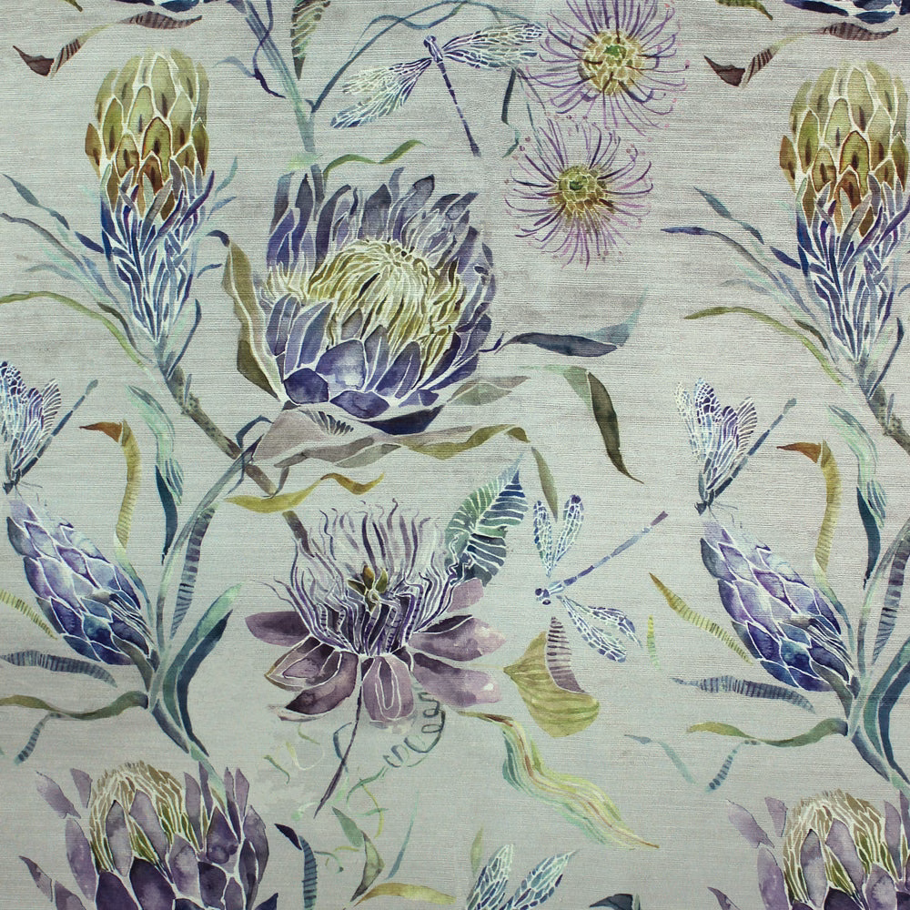 Painterly lilac and purple floral fabric on a pale ground with green-blue leaves