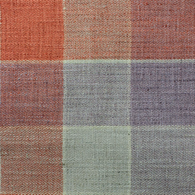 Textured woven check fabric swatch in muted brick red, sage and grey tones