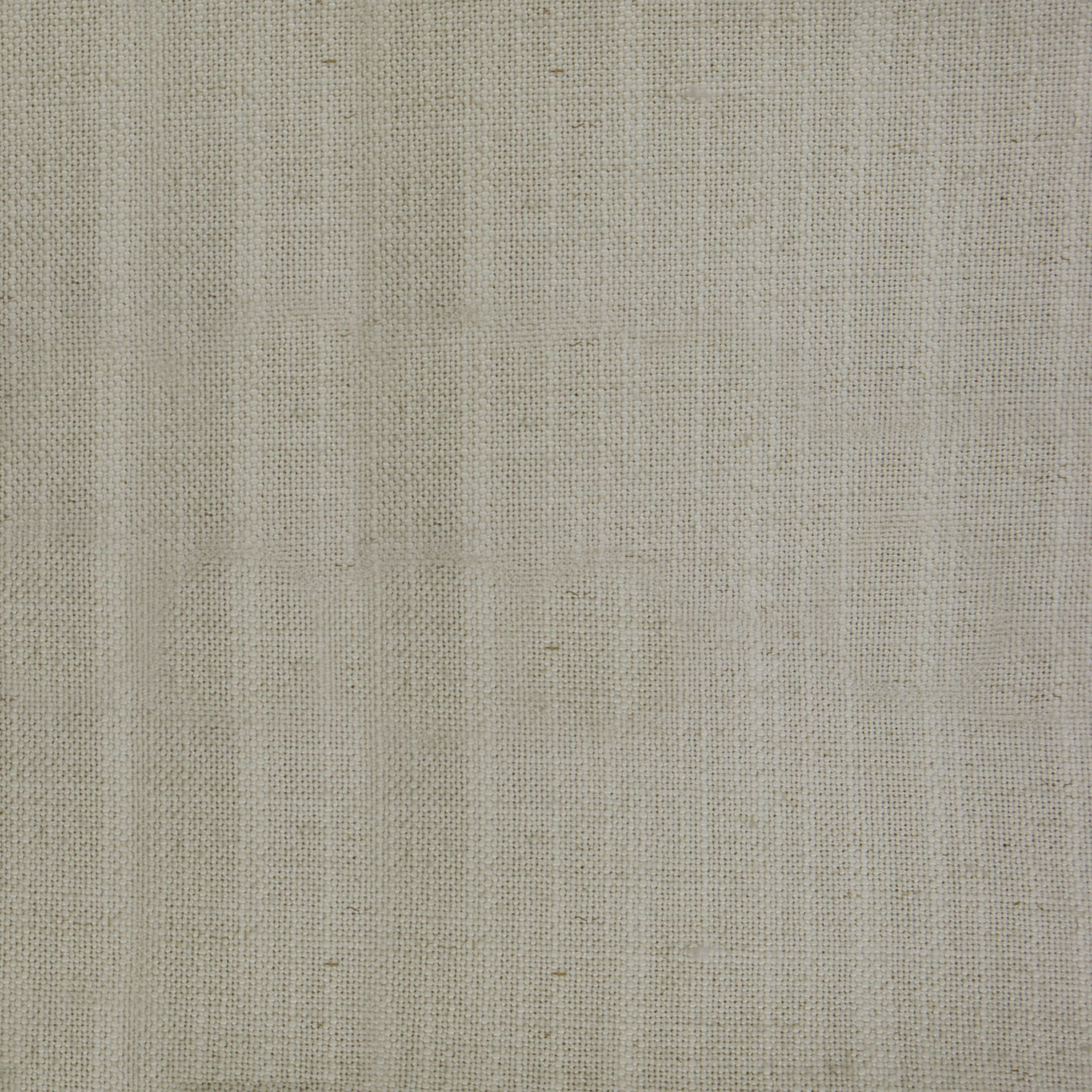 Close-up of a warm beige plain woven fabric with fine linen-like texture