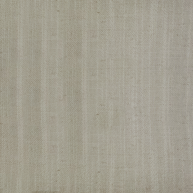 Close-up of a warm beige plain woven fabric with fine linen-like texture