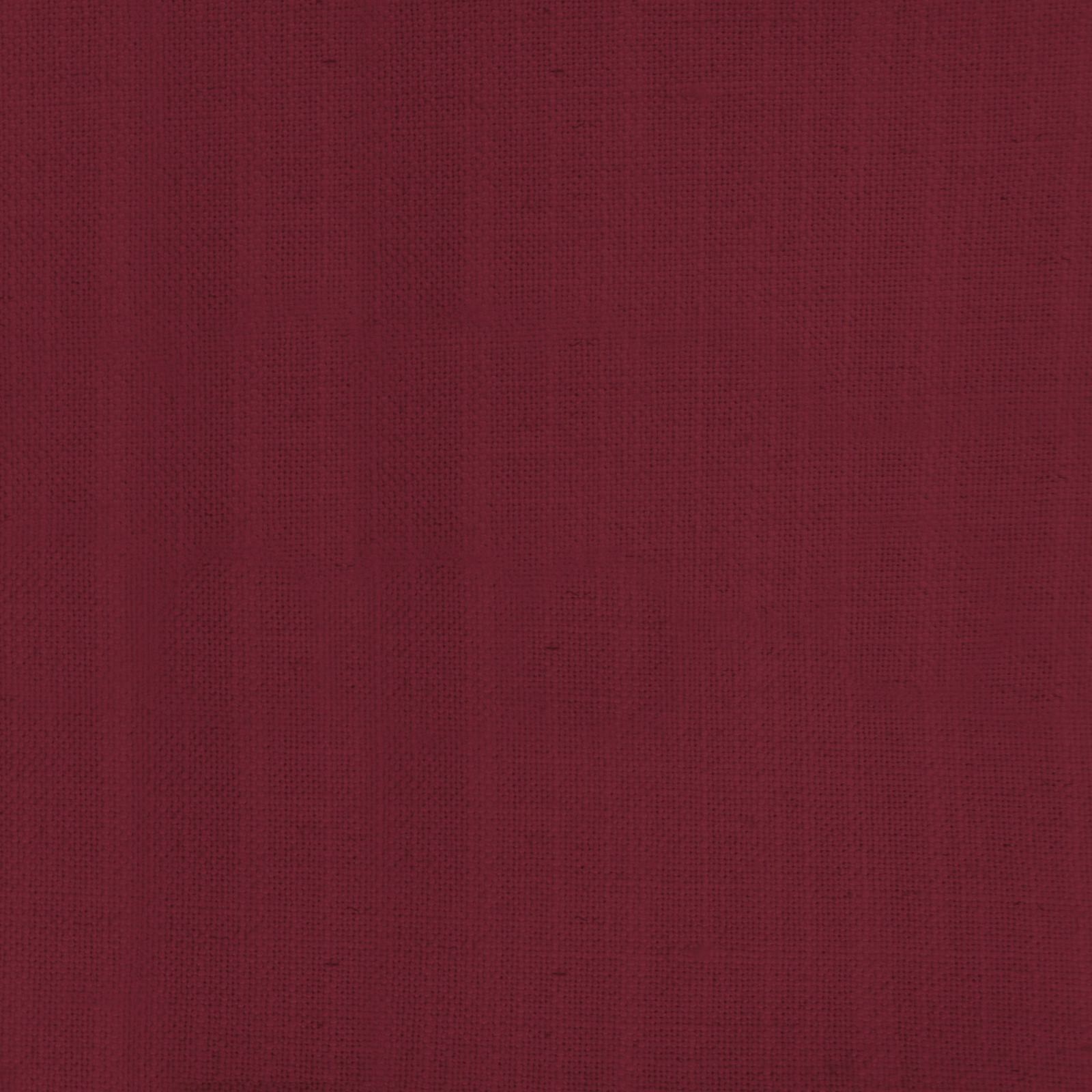 Close-up of deep burgundy plain-woven fabric with a fine matte texture