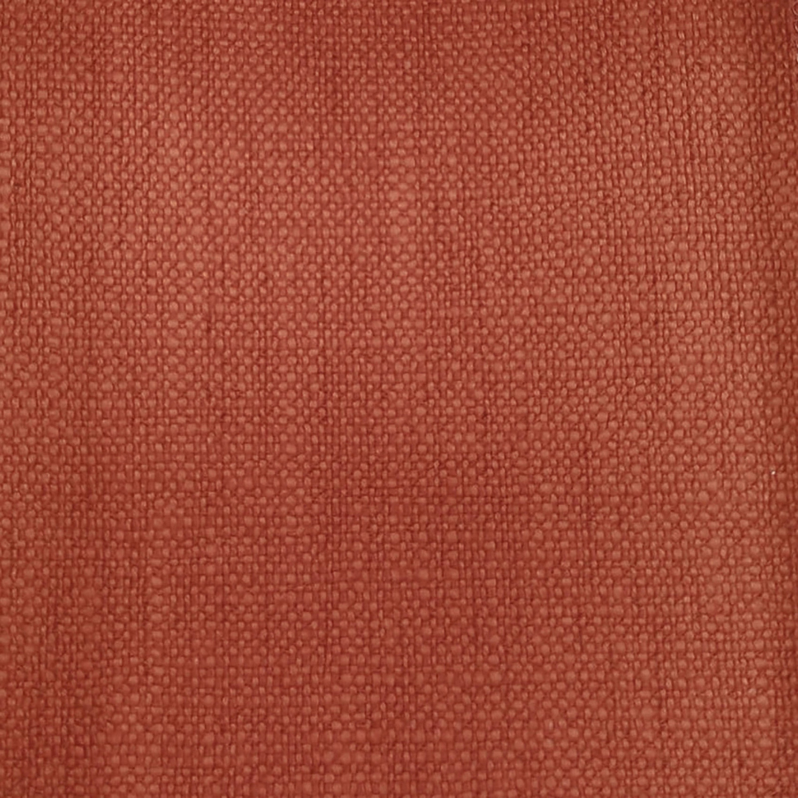 Close-up of a textured terracotta orange woven fabric with a tight plain weave