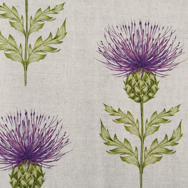 Pale linen-look fabric with large purple thistle flowers and green leaves
